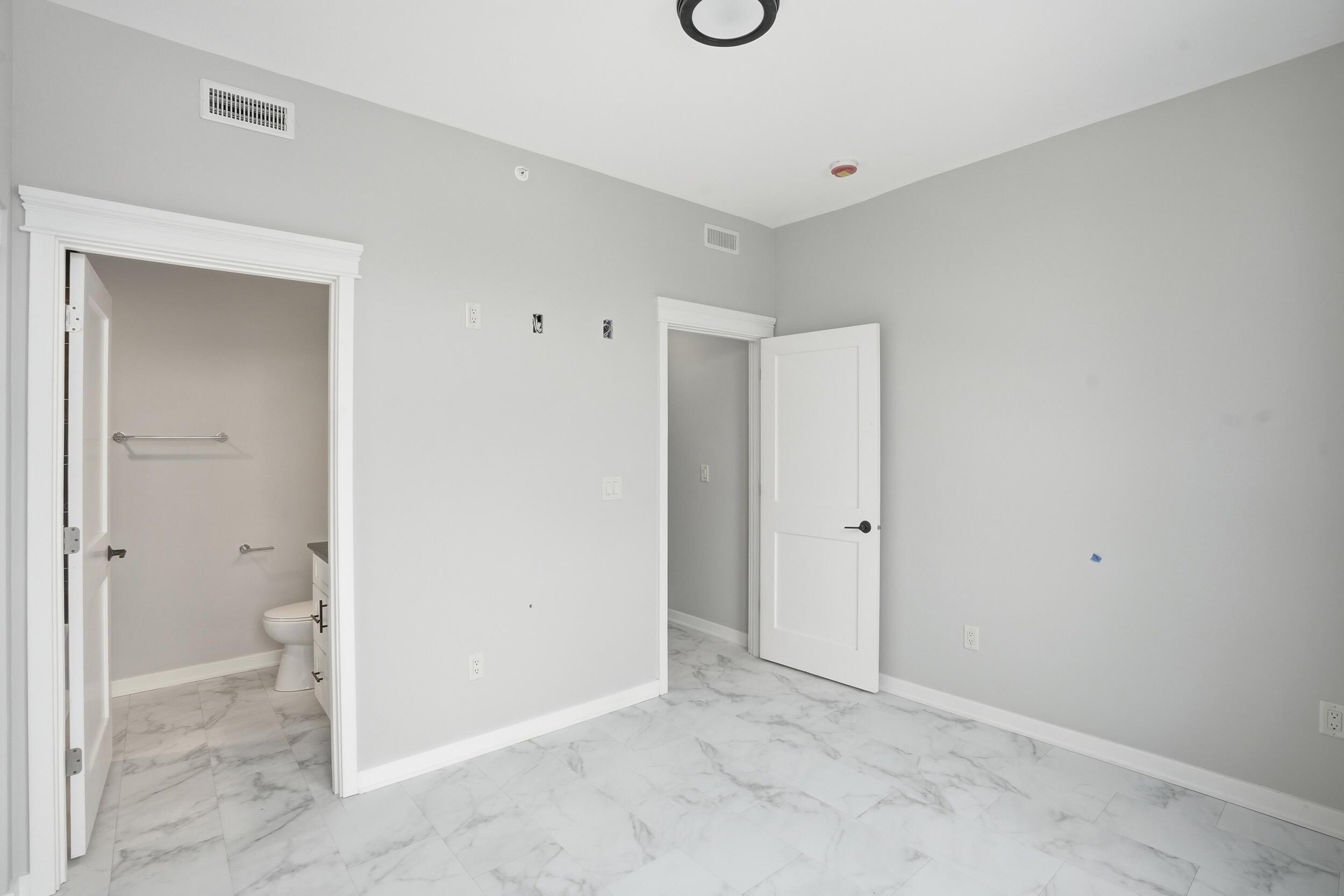 1540 119th Street, Unit 201 Whiting, IN 46394 - Photo 13 of 17 a view of a bathroom with a toilet