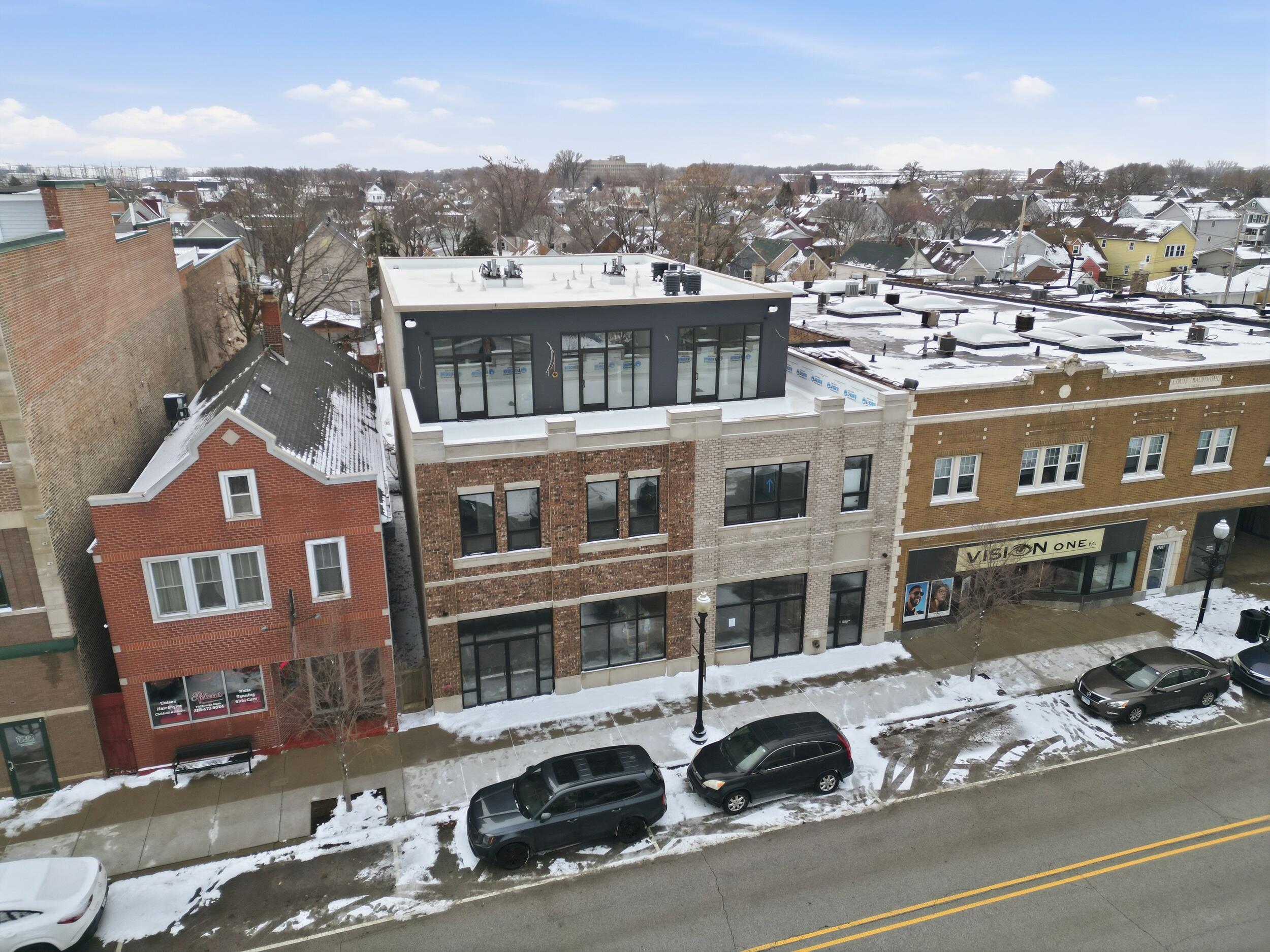 1540 119th Street, Unit 201 Whiting, IN 46394 - Photo 2 of 17 a city view with tall buildings