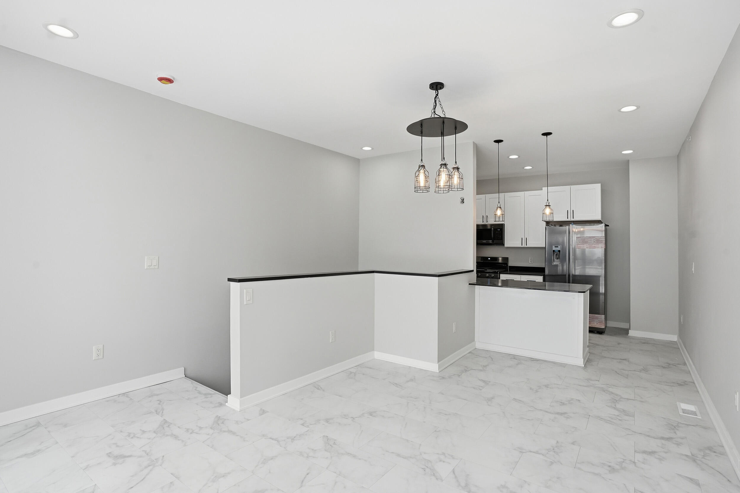 1540 119th Street, Unit 201 Whiting, IN 46394 - Photo 6 of 17 a large kitchen with a refrigerator and a stove