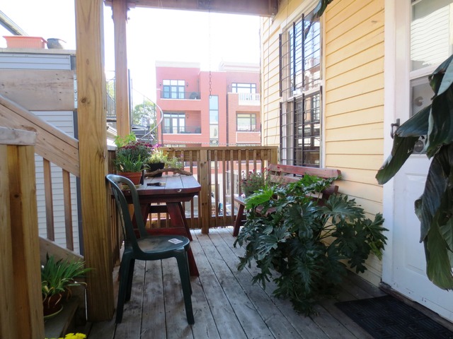 802 West Altgeld Street Chicago, IL 60614 - Photo 11 of 18 a view of a balcony with chairs and wooden floor
