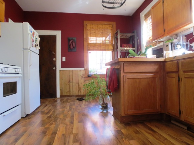 802 West Altgeld Street Chicago, IL 60614 - Photo 14 of 18 a kitchen with a refrigerator and wooden floor