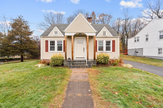 a front view of a house with a yard