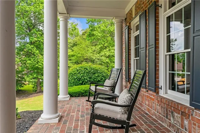 a kitchen with stainless steel appliances granite countertop a refrigerator and a window
