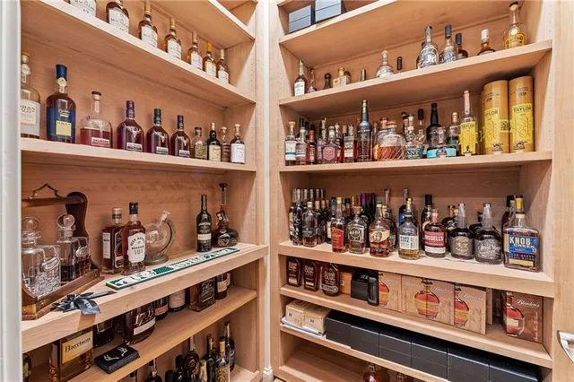 a bathroom with a granite countertop toilet a sink and a bathtub