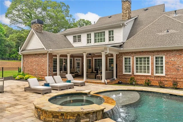 a view of a garden with wooden fence