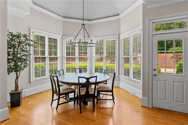 a view of a livingroom with furniture and staircase