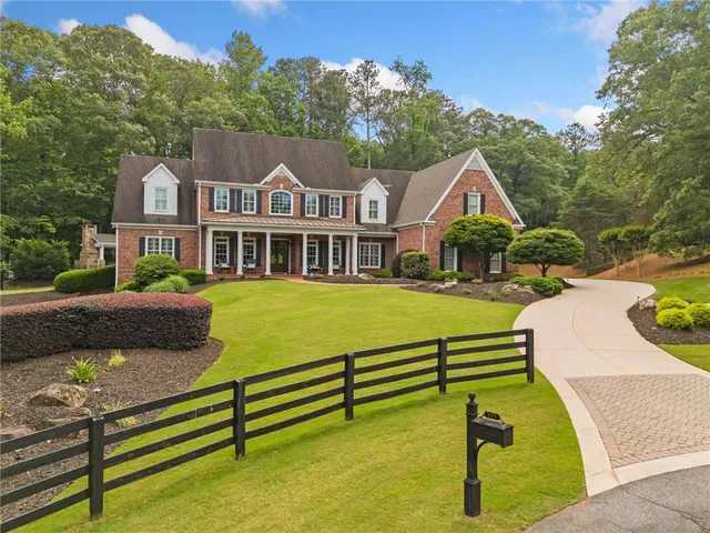 a view of a brick house with a large window
