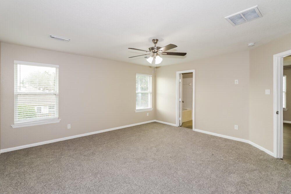 13214 Montclair Point Court Houston, TX 77047 - Photo 9 of 17 a view of an empty room with a window
