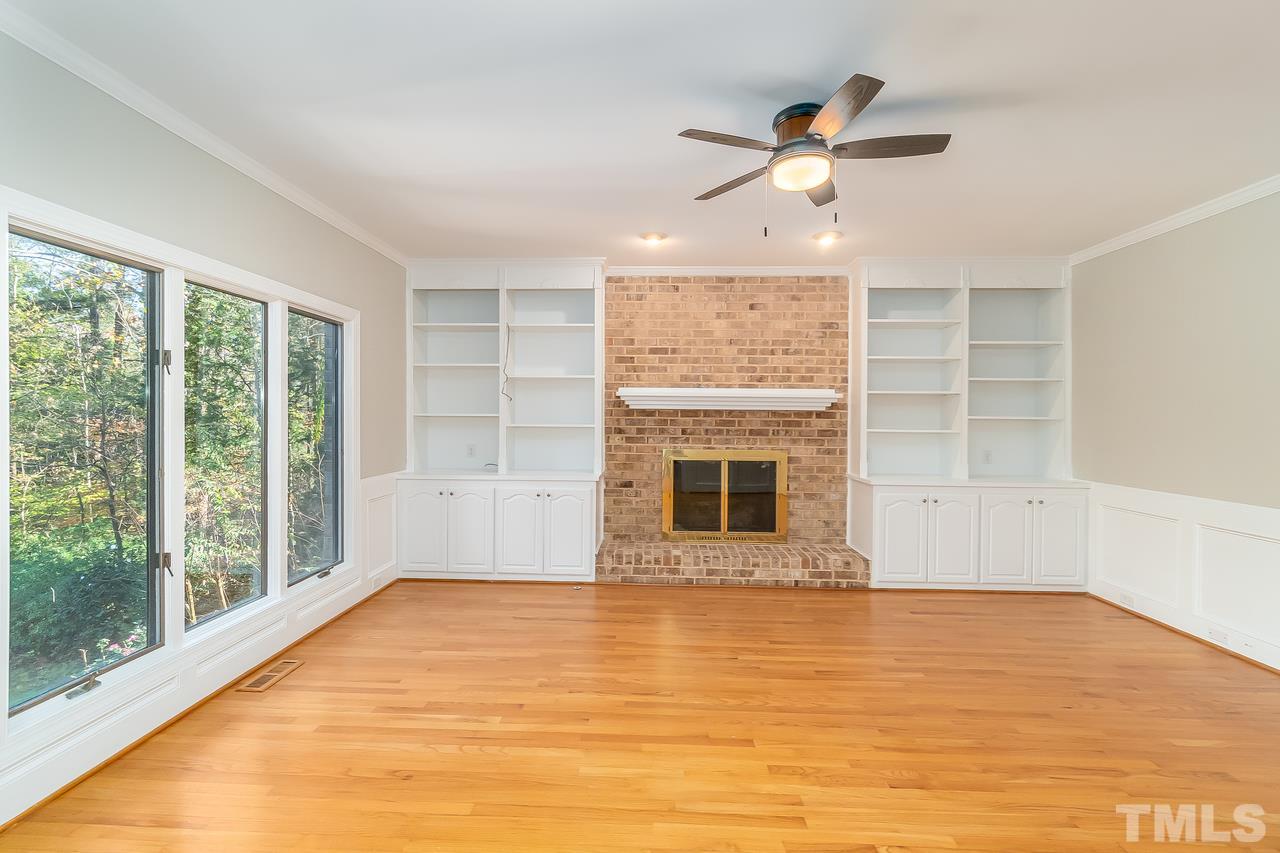 3908 Westwood Place Raleigh, NC 27613 - Photo 13 of 30 Family room with built-in shelving