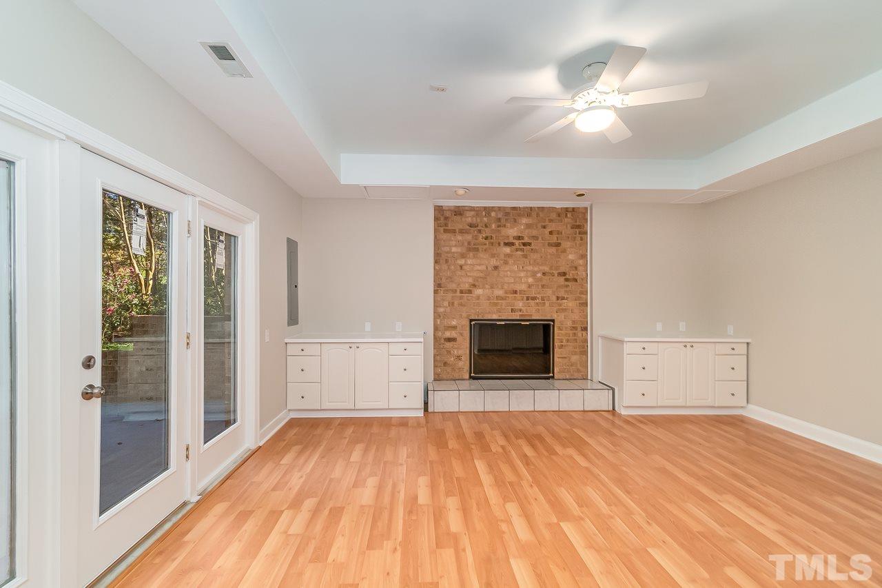 3908 Westwood Place Raleigh, NC 27613 - Photo 26 of 30 Rec area in basement with double doors leading to back patio