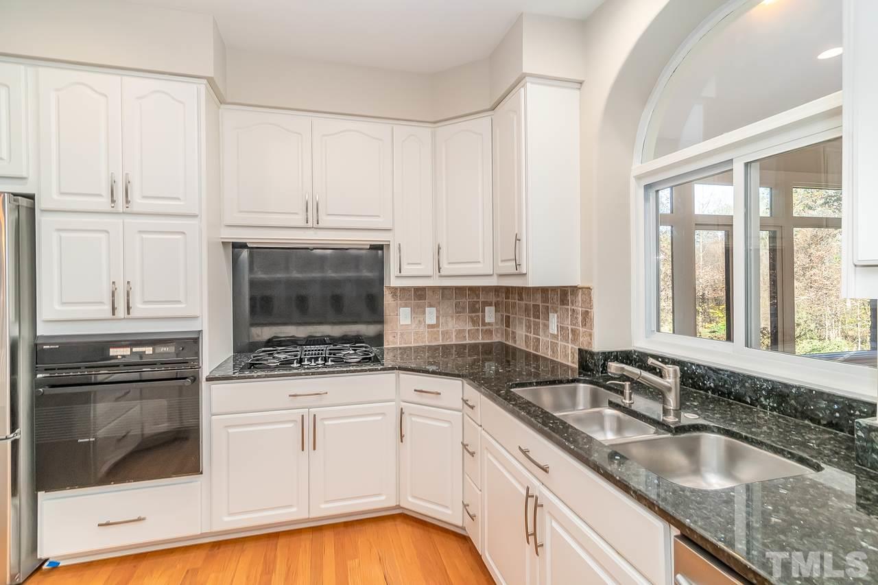 3908 Westwood Place Raleigh, NC 27613 - Photo 8 of 30 Plenty of cabinets with gas stove