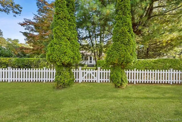 a view of a yard with deck and a garden