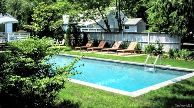 a view of a backyard with sitting area and furniture
