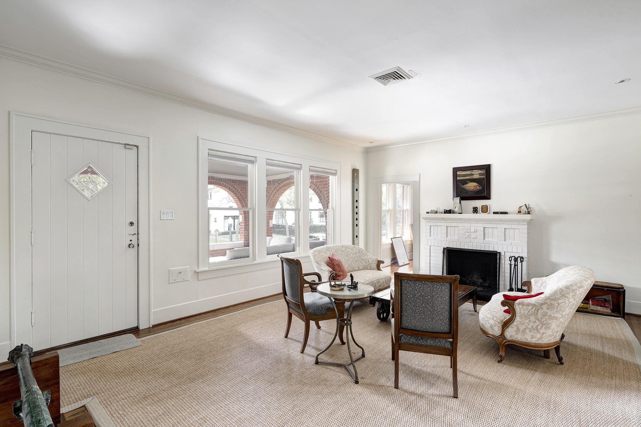 1902 Bolsover Street Houston, TX 77005 - Photo 3 of 27 Front door opens to a spacious and light-filled living room with a fireplace and gorgeous wood floors.