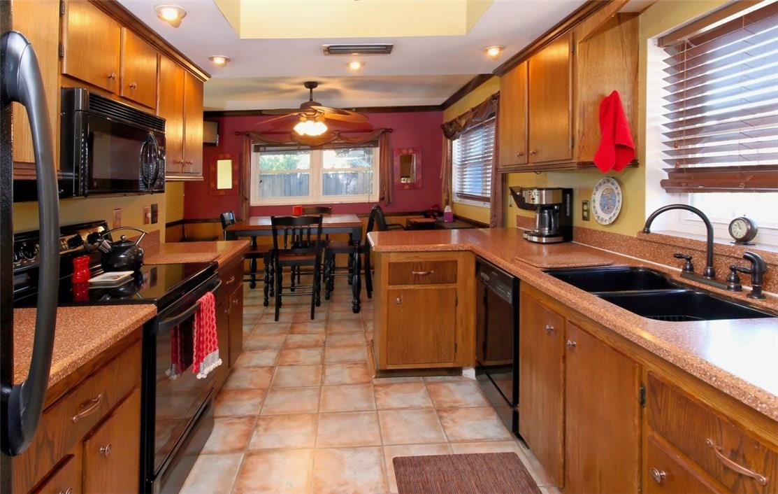9348 Southwest 1st Place Boca Raton, FL 33428 - Photo 4 of 17 a kitchen that has a lot of cabinets in it