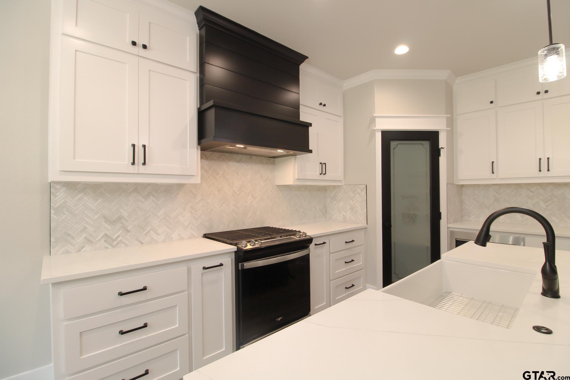 1069 Stagecoach Bend Bullard, TX 75757 - Photo 16 of 44 a kitchen with a stove microwave and refrigerator