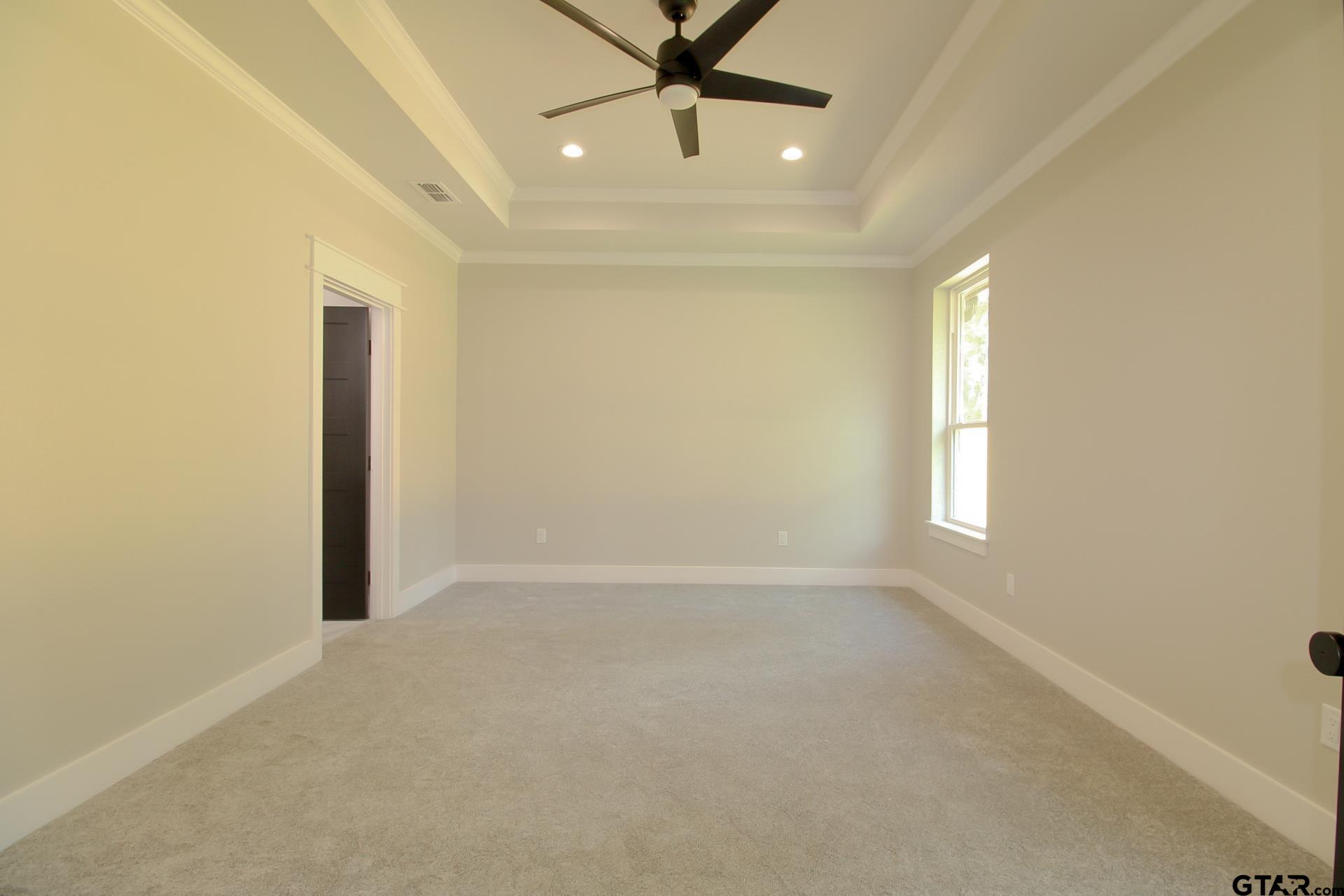 1069 Stagecoach Bend Bullard, TX 75757 - Photo 18 of 44 an empty room with windows and fan