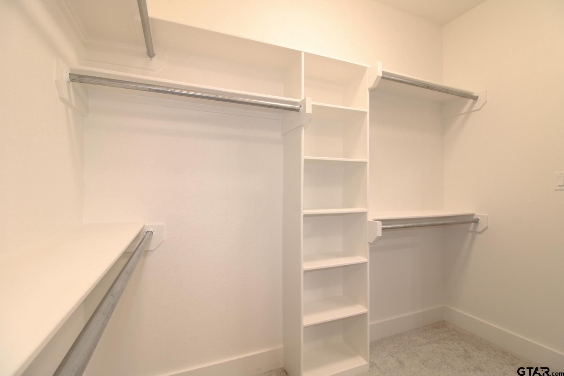 1069 Stagecoach Bend Bullard, TX 75757 - Photo 27 of 44 a view of an empty walk in closet