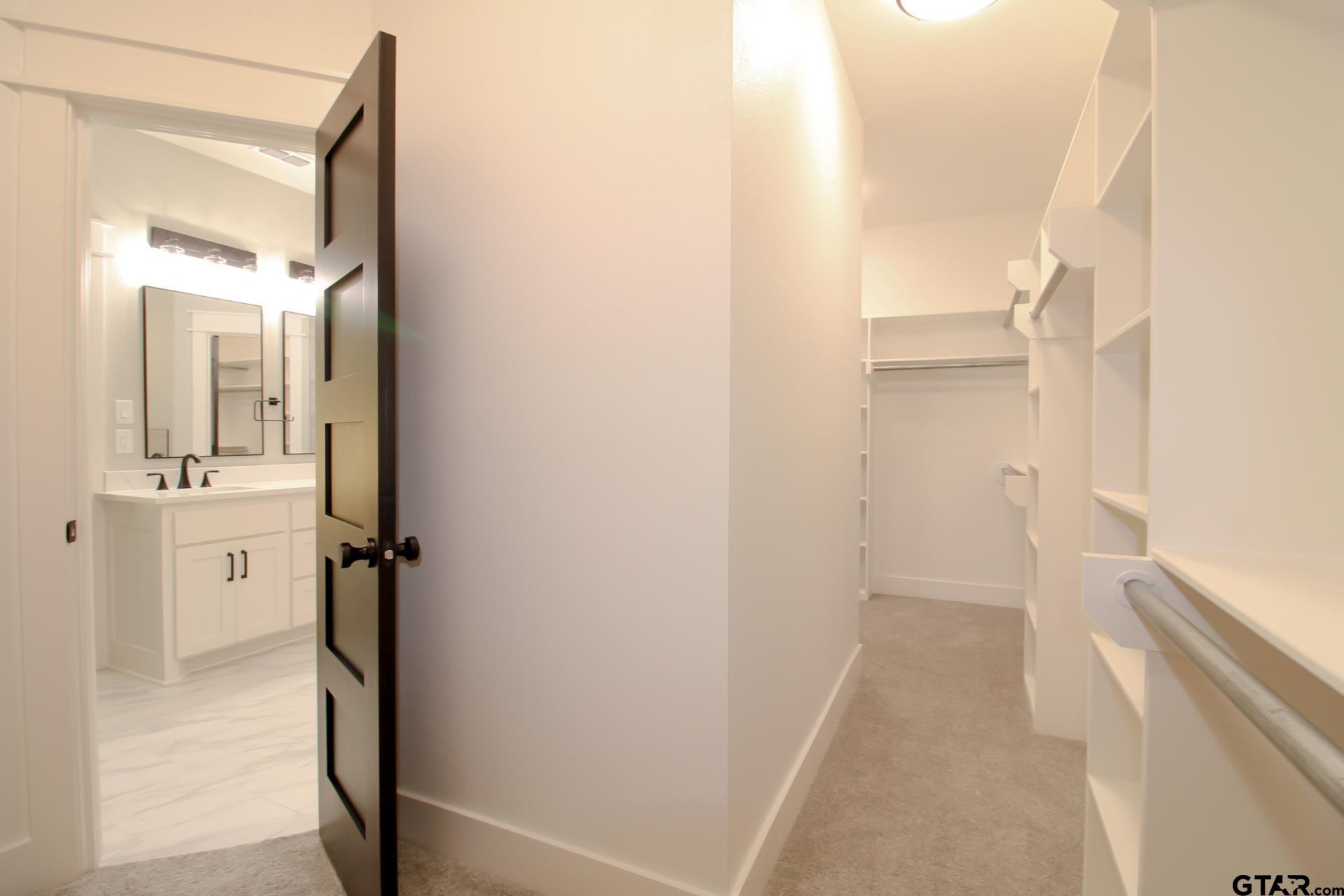 1069 Stagecoach Bend Bullard, TX 75757 - Photo 29 of 44 a view of a bathroom from a hallway