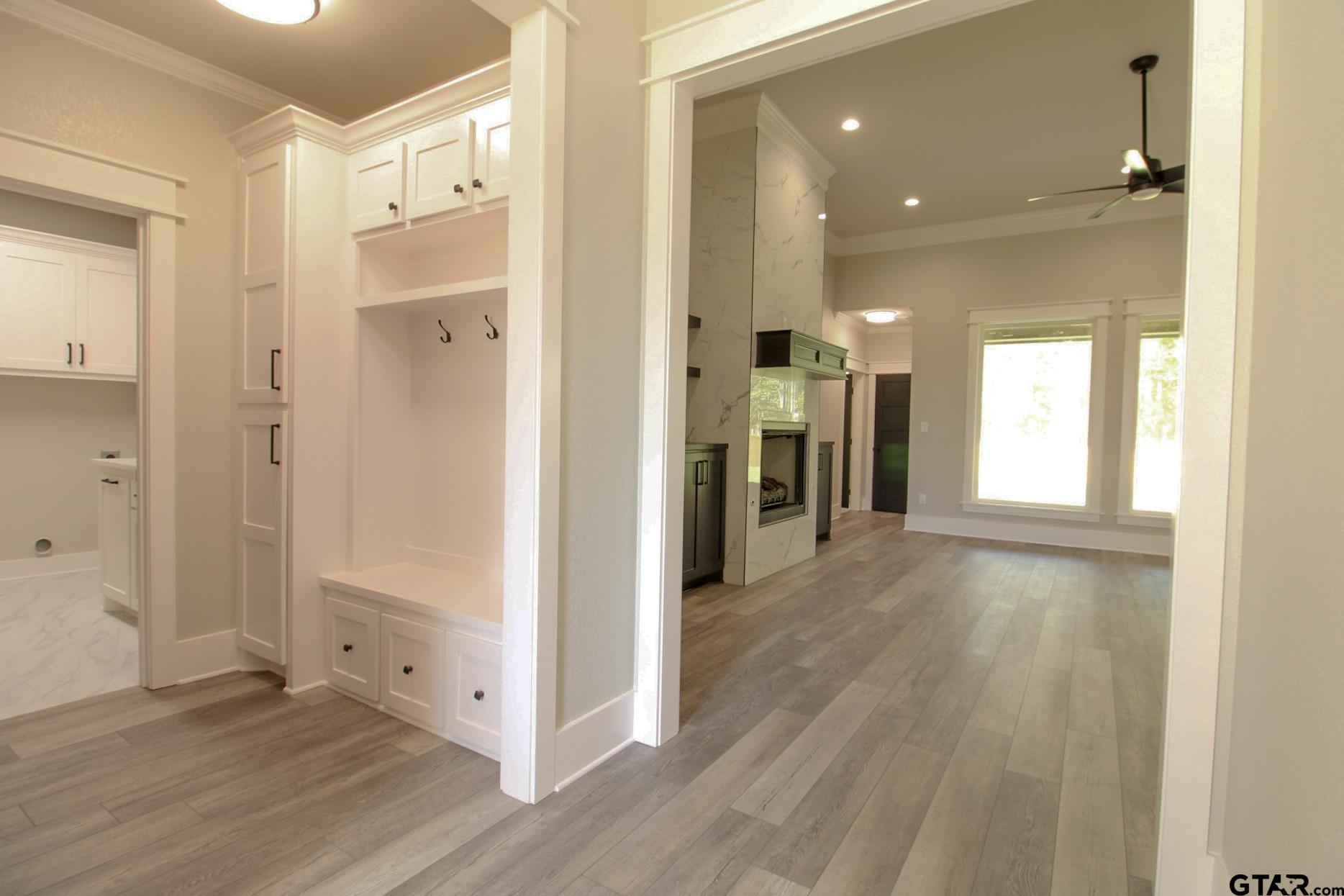 1069 Stagecoach Bend Bullard, TX 75757 - Photo 37 of 44 a view of a hallway with wooden floor and closet area