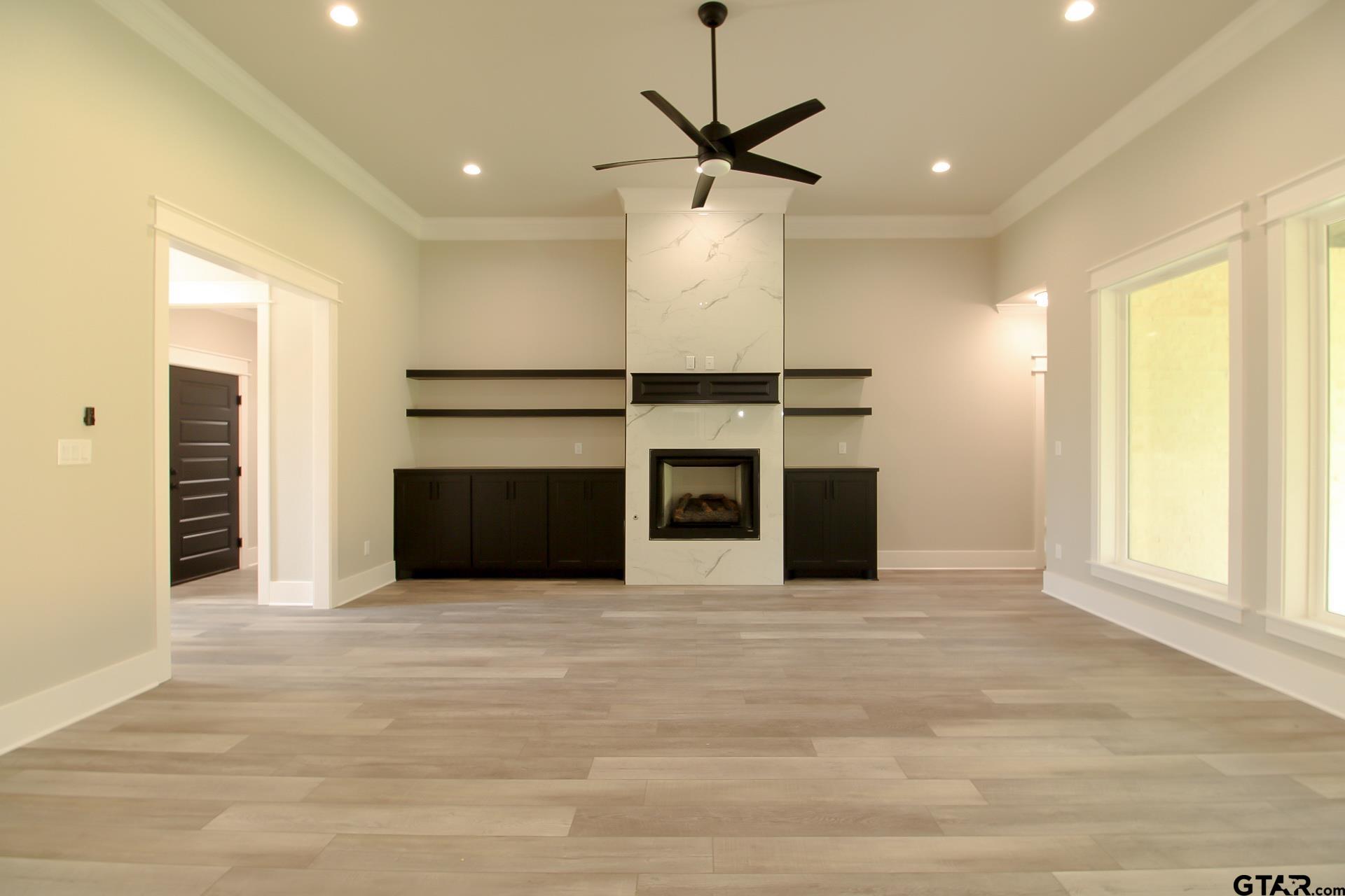 1069 Stagecoach Bend Bullard, TX 75757 - Photo 7 of 44 a view of a kitchen with a sink and a ceiling fan