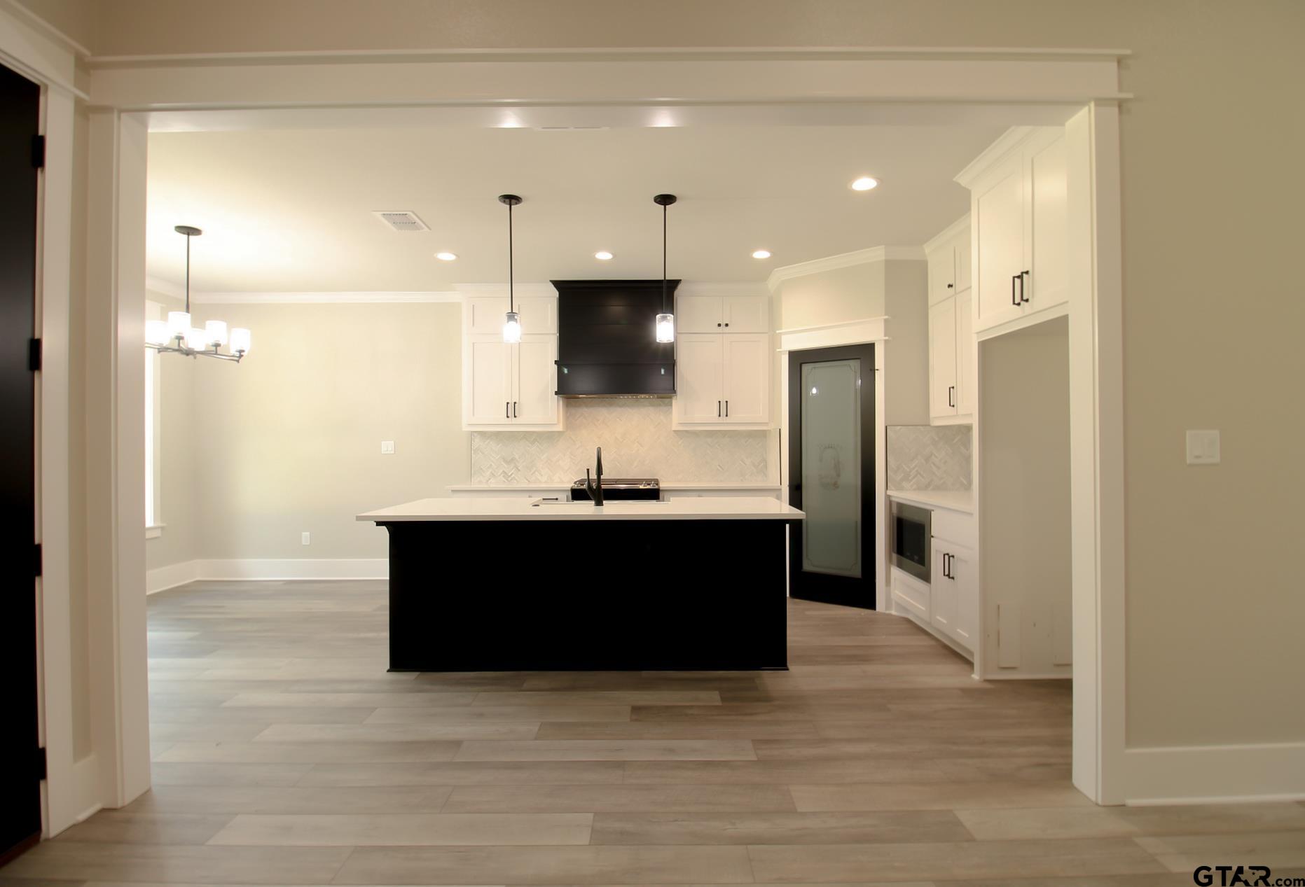 1069 Stagecoach Bend Bullard, TX 75757 - Photo 9 of 44 a large bathroom with a sink a large mirror and a shower