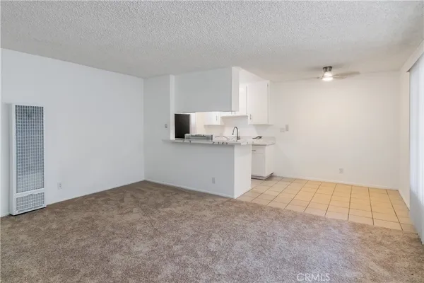 a view of a kitchen with a sink cabinets and a window