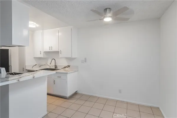 a kitchen with a sink cabinets and stainless steel appliances