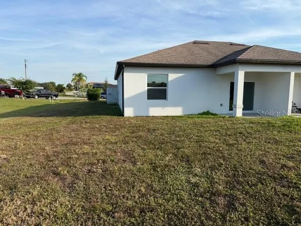 a house with trees in the background