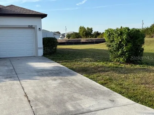 a view of a backyard with lake view