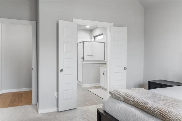 a living room with a bed and furniture