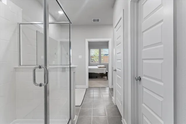 a view of a bathroom from a hallway