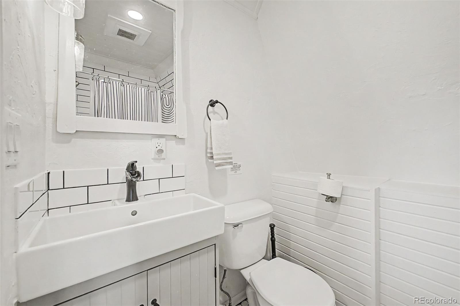 1365 Kokanee Road Fairplay, CO 80440 - Photo 21 of 45 a bathroom with a sink toilet and mirror
