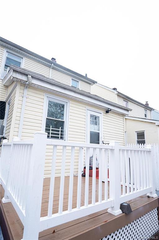 114-11 207th Street Queens, NY 11411 - Photo 13 of 15 View of property exterior featuring a deck