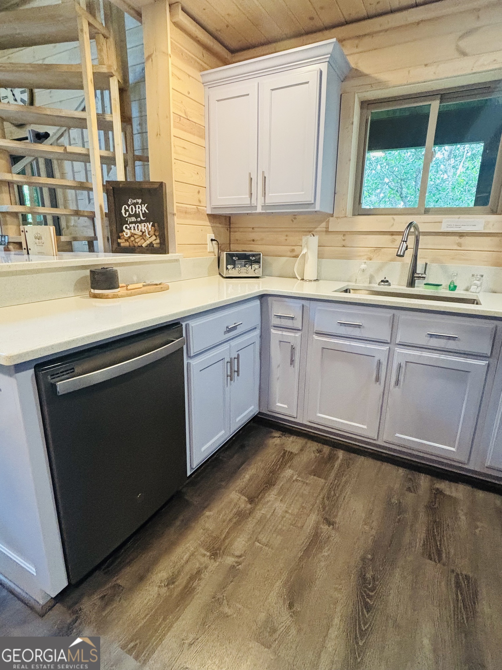 185 Walnut Ridge Drive Cleveland, GA 30528 - Photo 17 of 36 a kitchen with granite countertop sink and cabinets