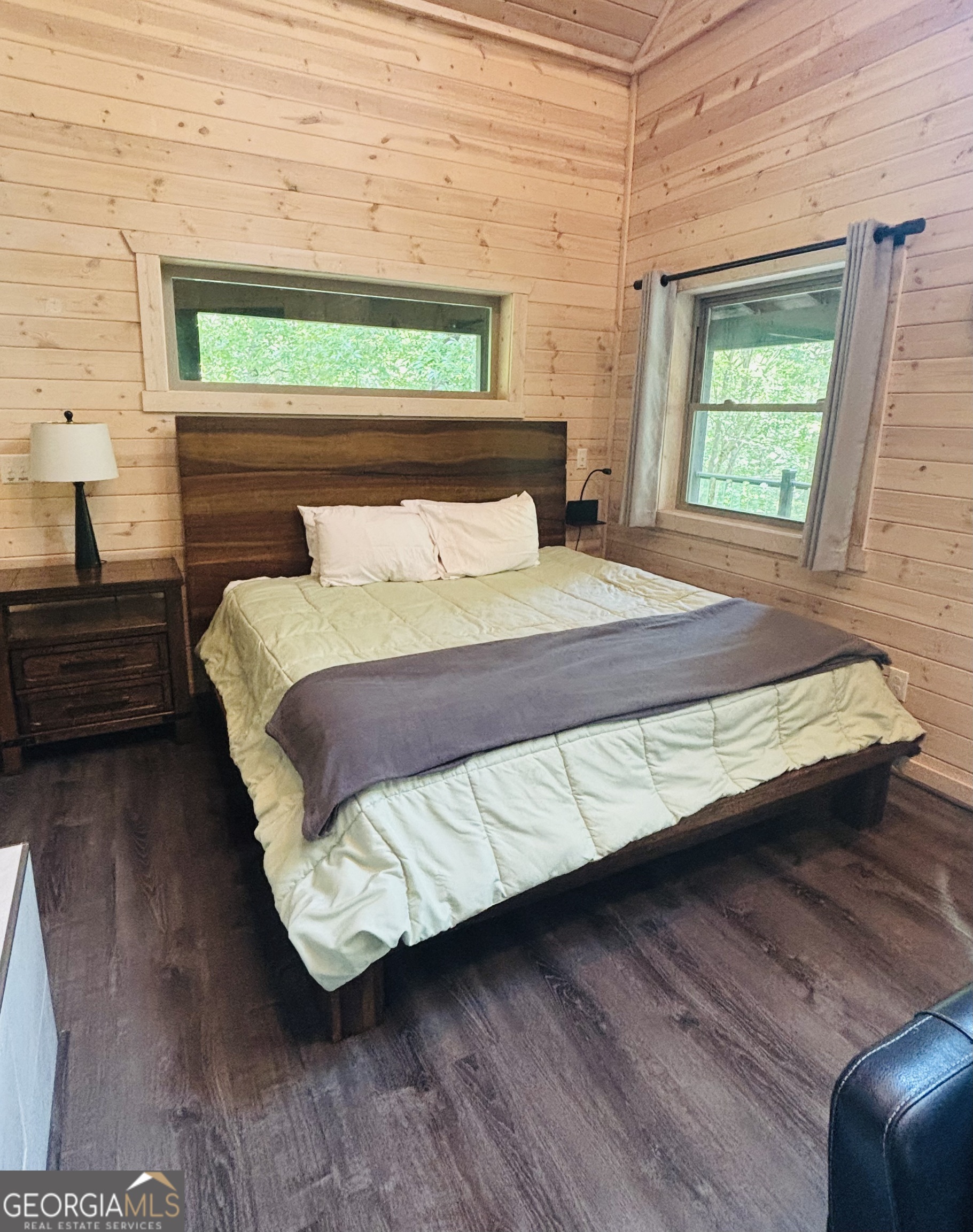 185 Walnut Ridge Drive Cleveland, GA 30528 - Photo 20 of 36 a bed sitting in a bedroom next to a window