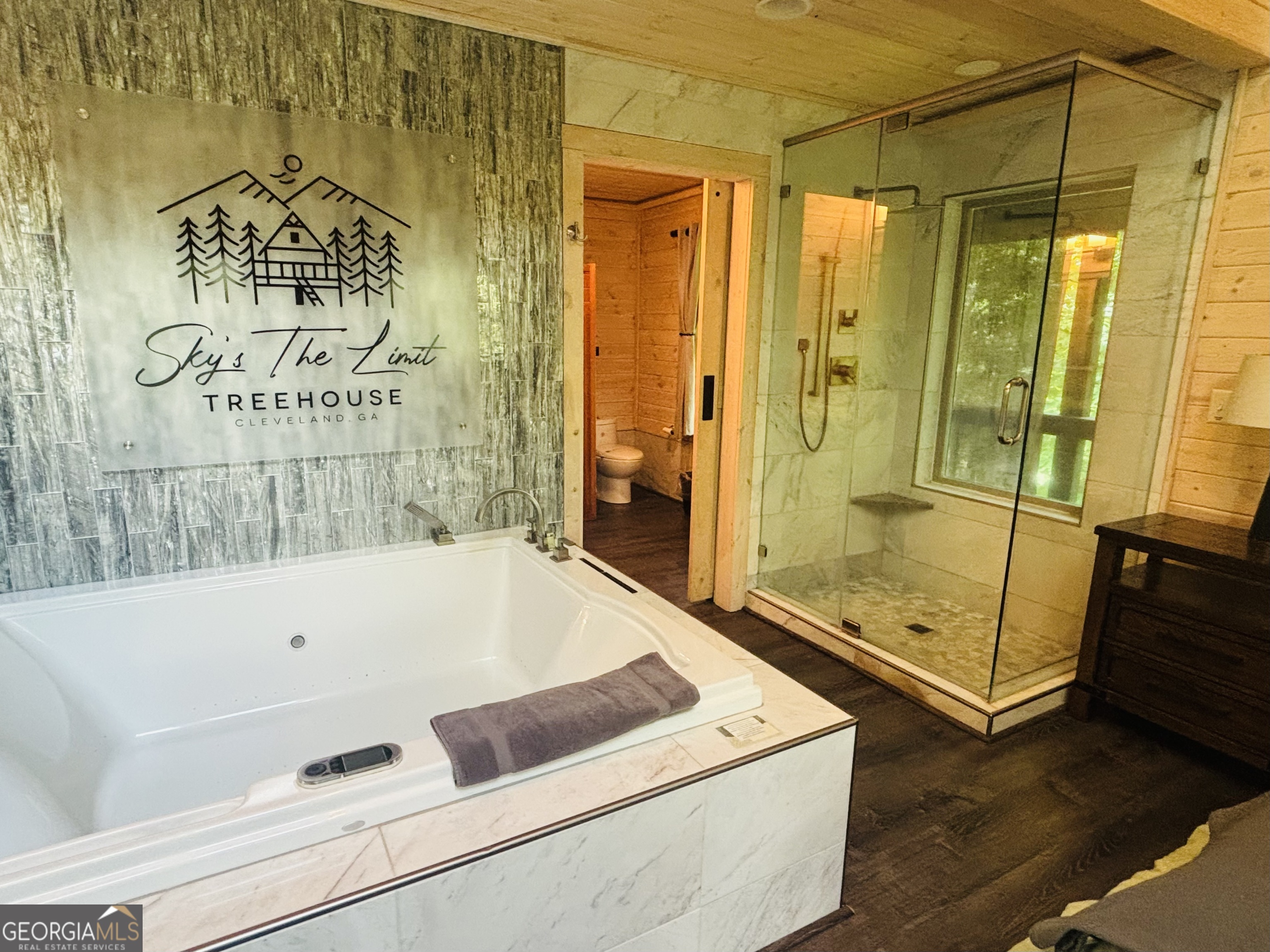 185 Walnut Ridge Drive Cleveland, GA 30528 - Photo 22 of 36 a bathroom with a tub and a shower