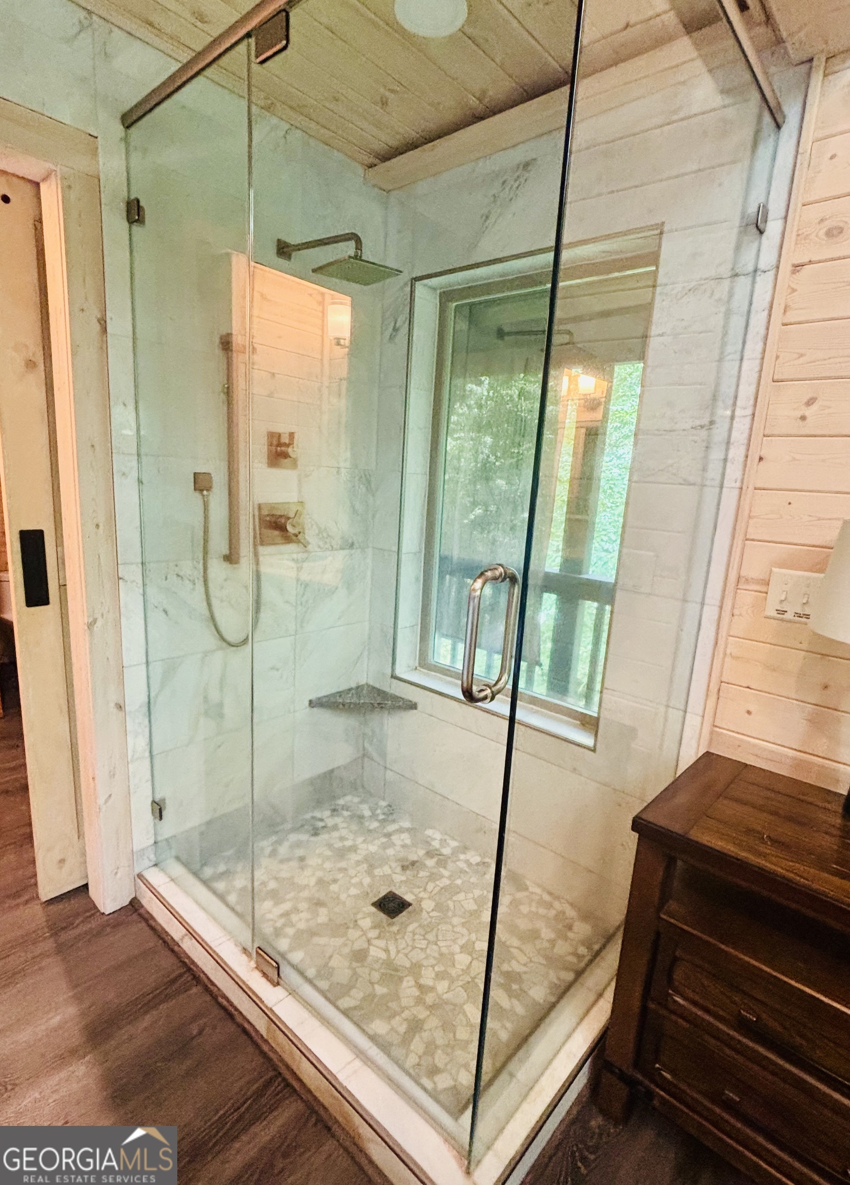 185 Walnut Ridge Drive Cleveland, GA 30528 - Photo 23 of 36 a bathroom with a glass shower door and a window