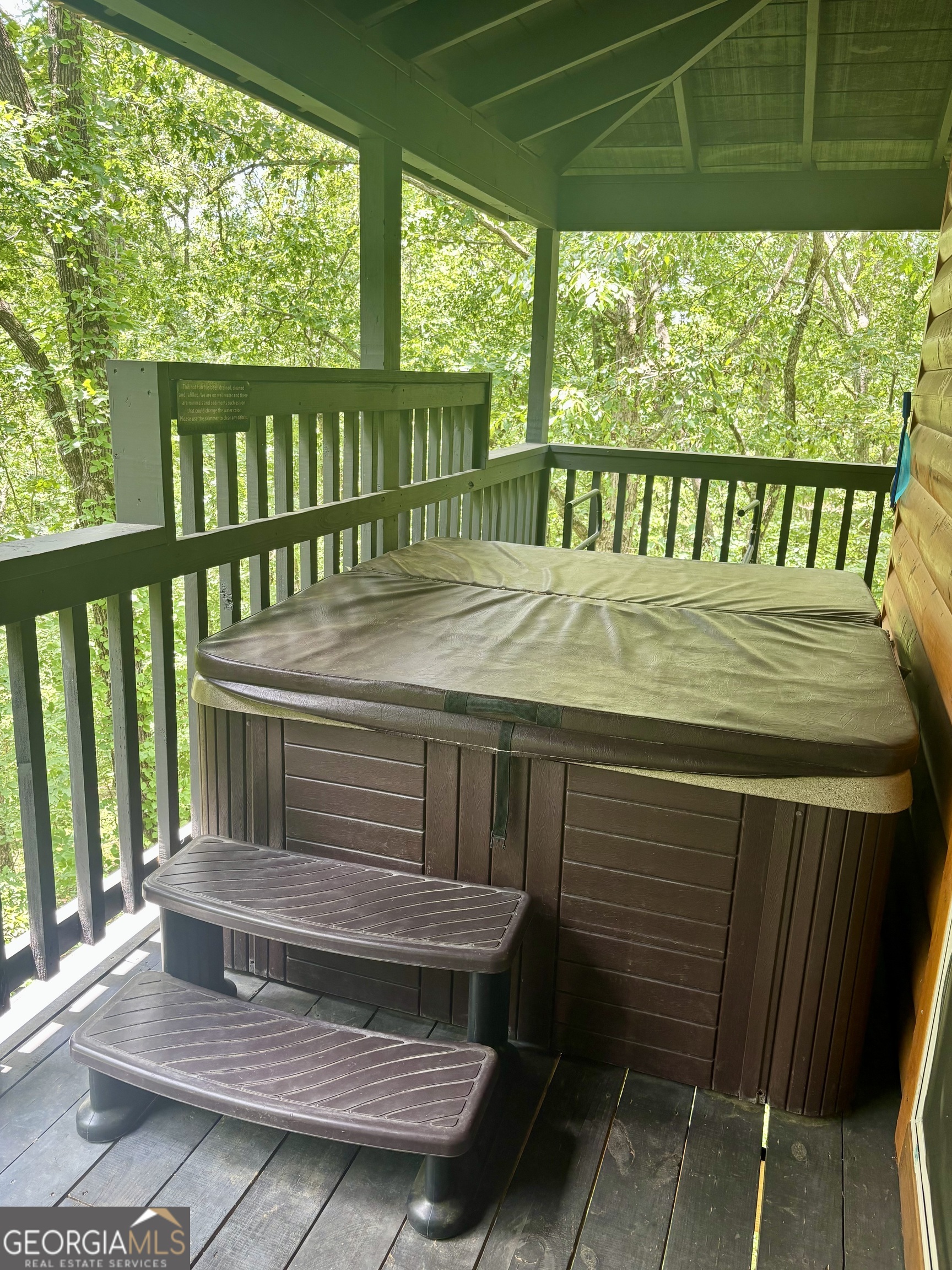 185 Walnut Ridge Drive Cleveland, GA 30528 - Photo 32 of 36 a view of a wooden deck with a bench