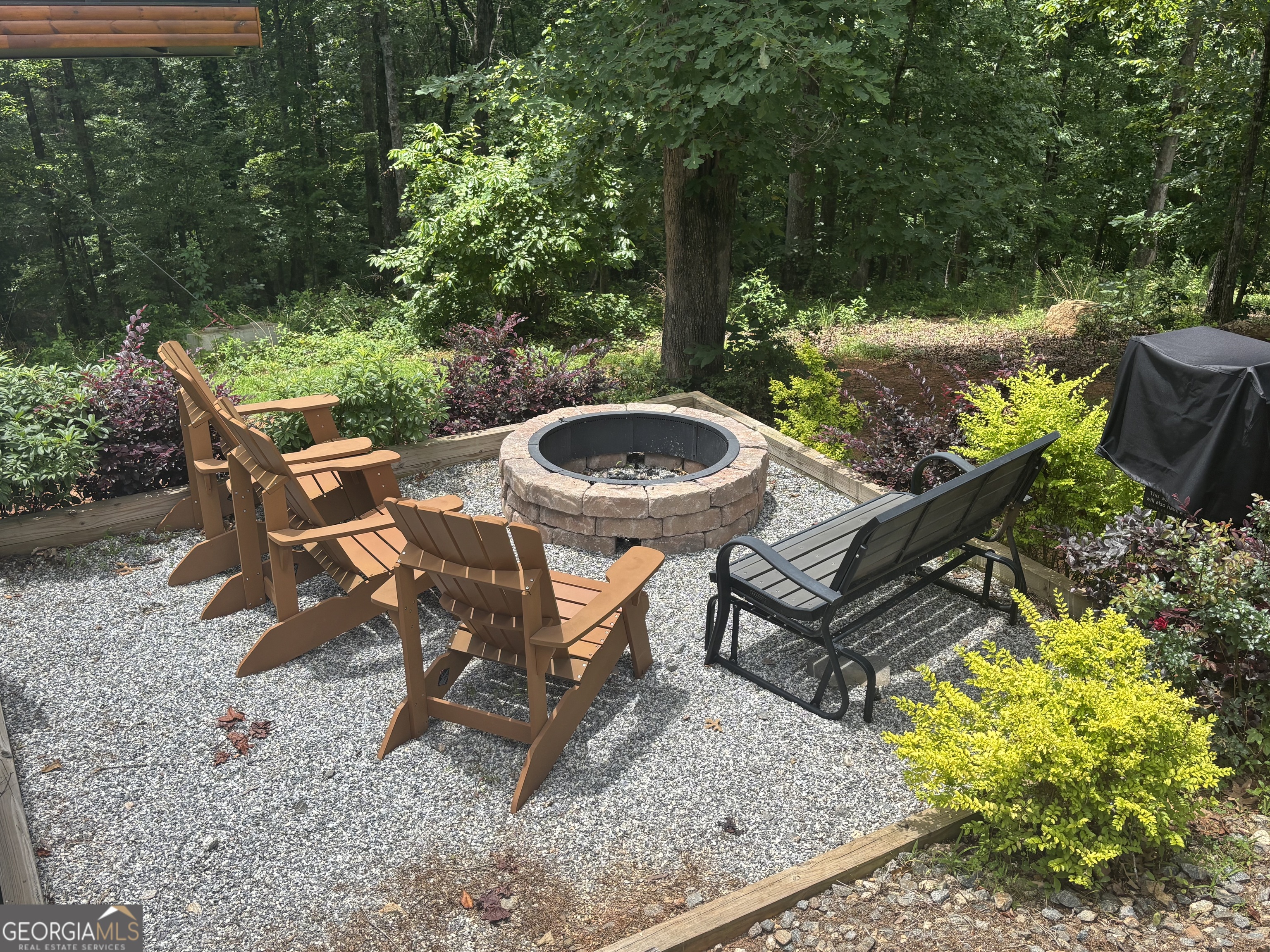 185 Walnut Ridge Drive Cleveland, GA 30528 - Photo 7 of 36 a view of a backyard with furniture and a garden
