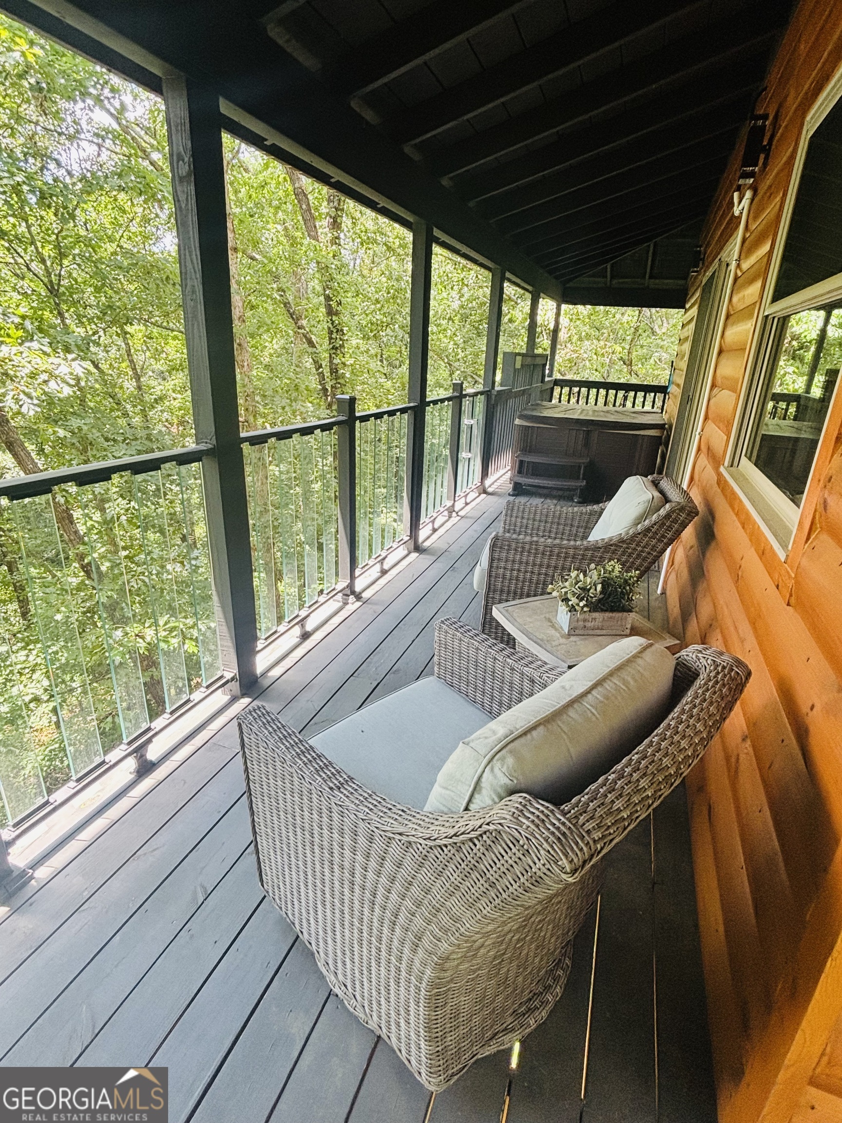185 Walnut Ridge Drive Cleveland, GA 30528 - Photo 9 of 36 a view of a porch with furniture and wooden floor