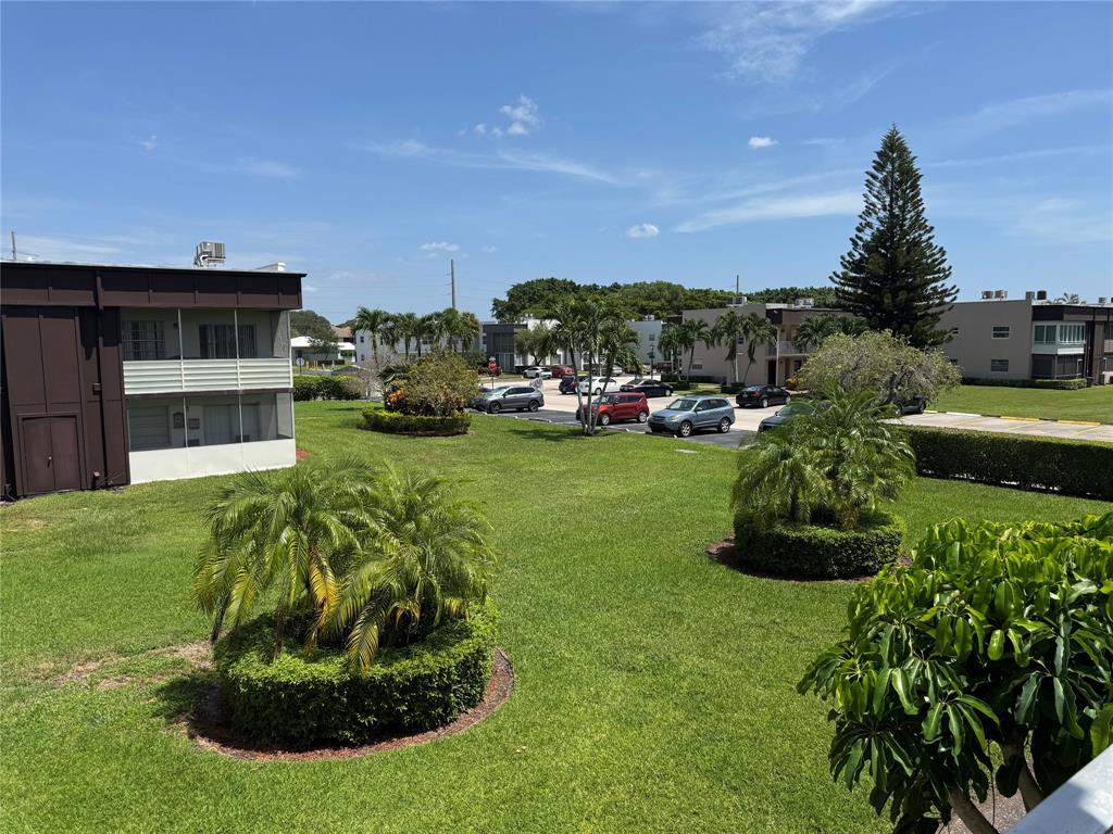 768 P Normandy, Unit 768 Delray Beach, FL 33484 - Photo 14 of 34 a view of a garden with a slide