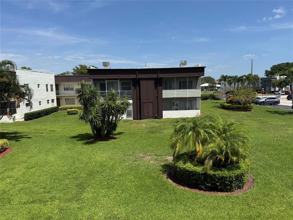 768 P Normandy, Unit 768 Delray Beach, FL 33484 - Photo 15 of 34 a house view with a garden space