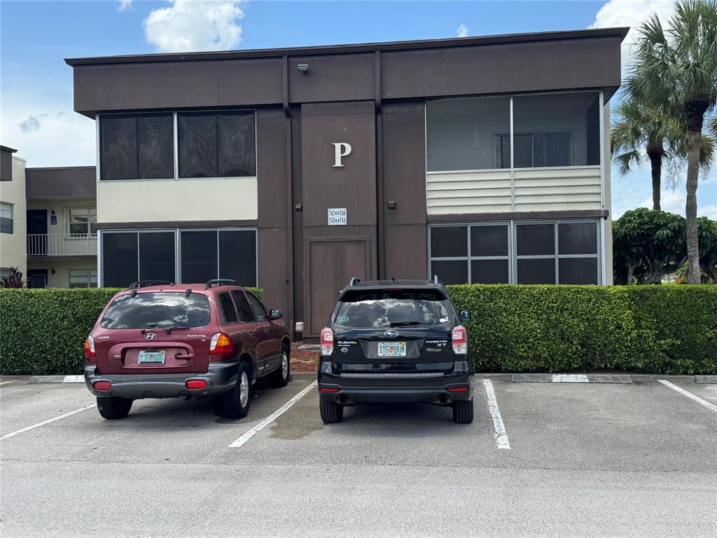 768 P Normandy, Unit 768 Delray Beach, FL 33484 - Photo 16 of 34 a car parked in front of a house