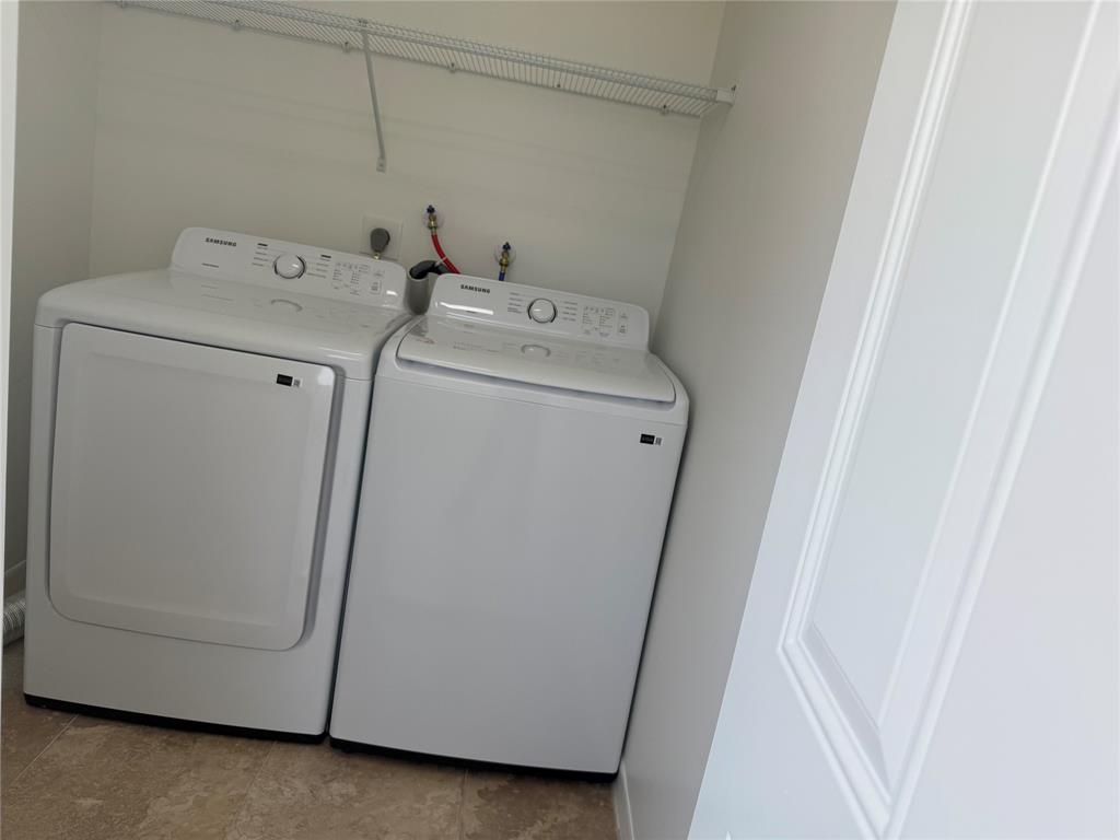 768 P Normandy, Unit 768 Delray Beach, FL 33484 - Photo 6 of 34 a utility room with dryer and washer