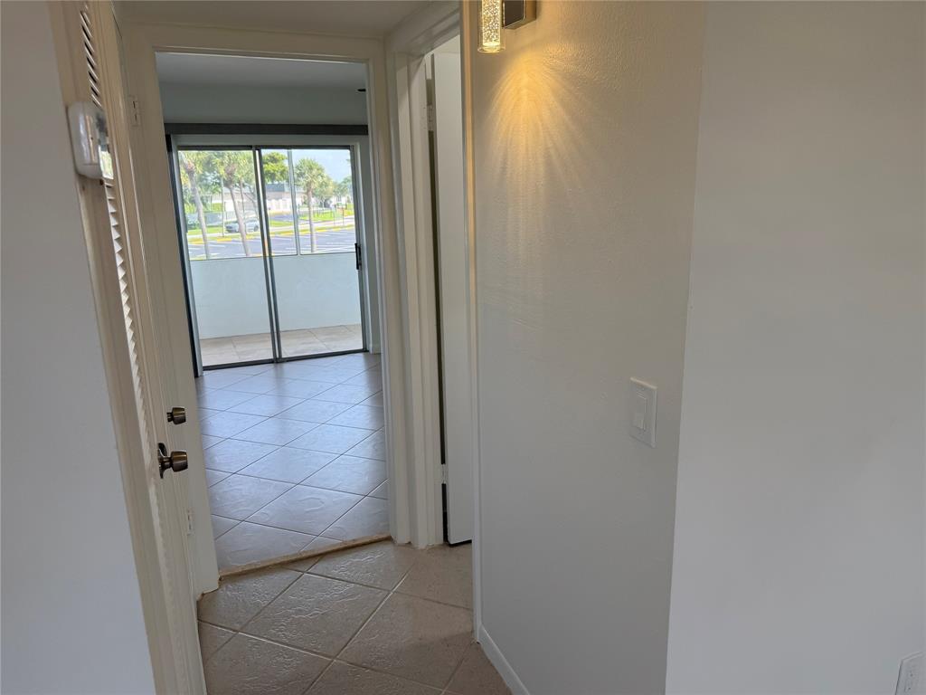 768 P Normandy, Unit 768 Delray Beach, FL 33484 - Photo 8 of 34 a view of hallway with window