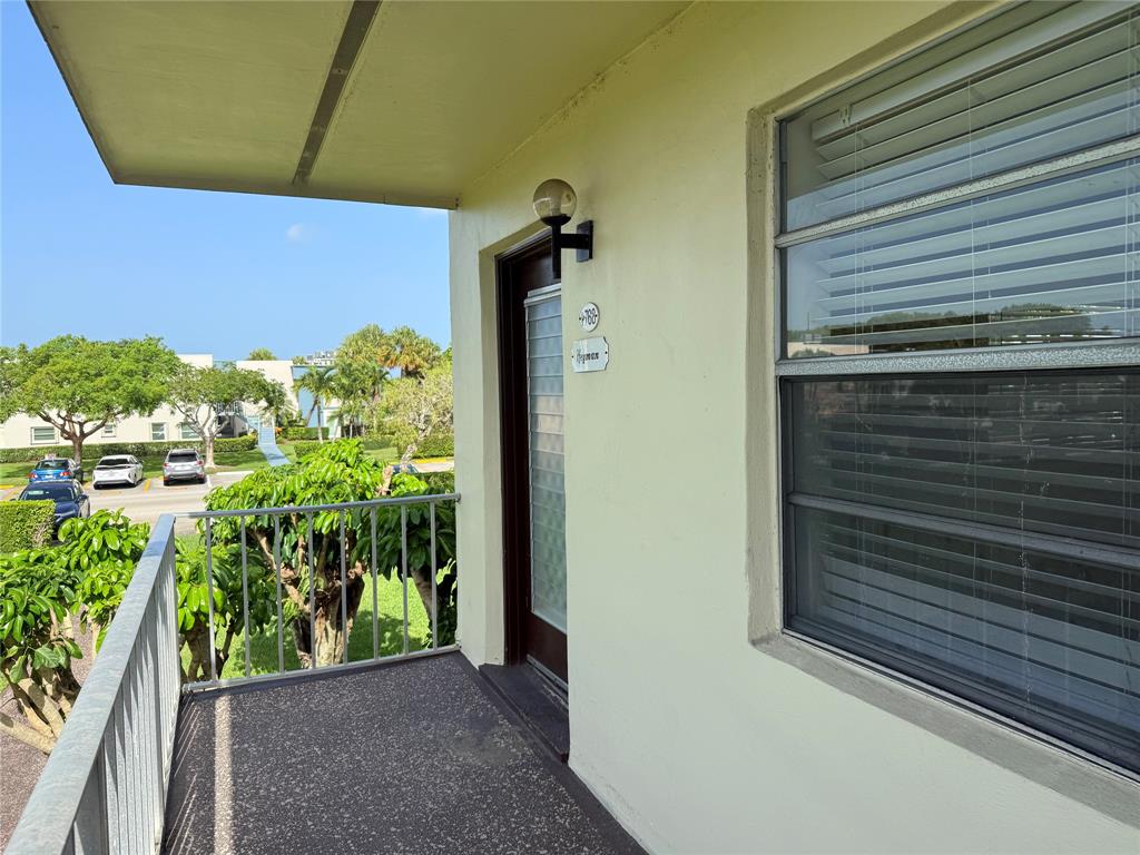 768 P Normandy, Unit 768 Delray Beach, FL 33484 - Photo 10 of 34 a view of a door and chair