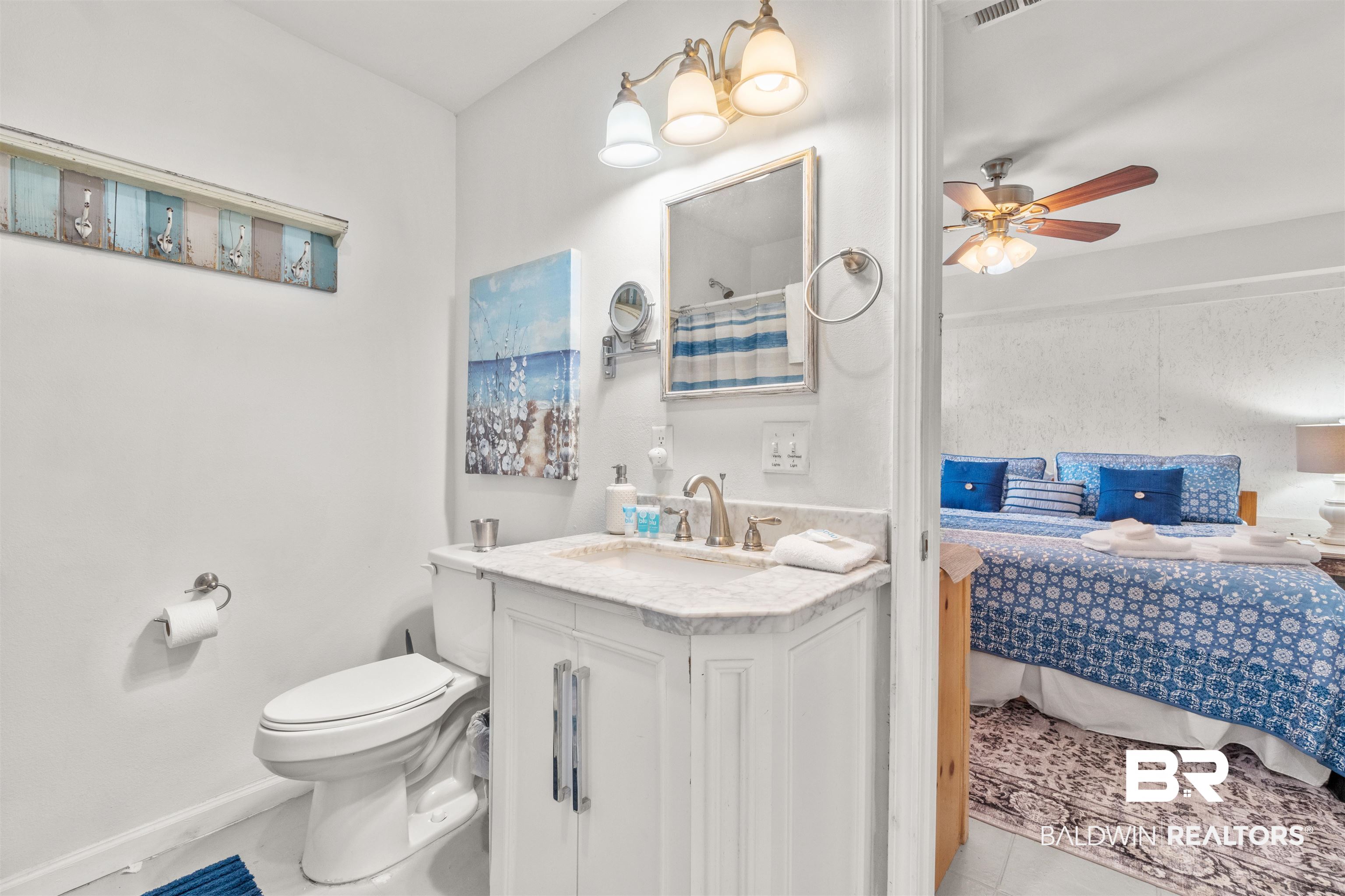 17595 River Road Summerdale, AL 36580 - Photo 11 of 29 Ensuite bathroom featuring vanity, ceiling fan, and curtained shower