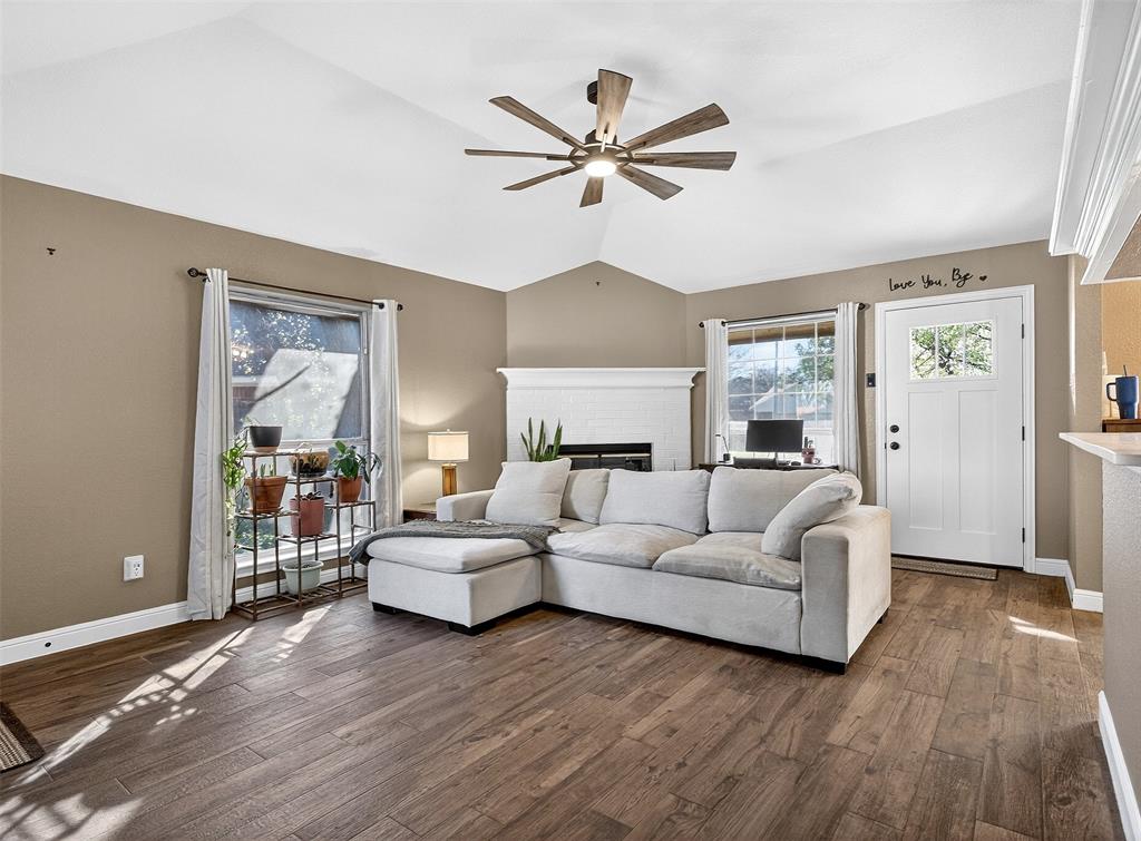 1006 Oakchase Court Azle, TX 76020 - Photo 6 of 19 a living room with furniture and a large window