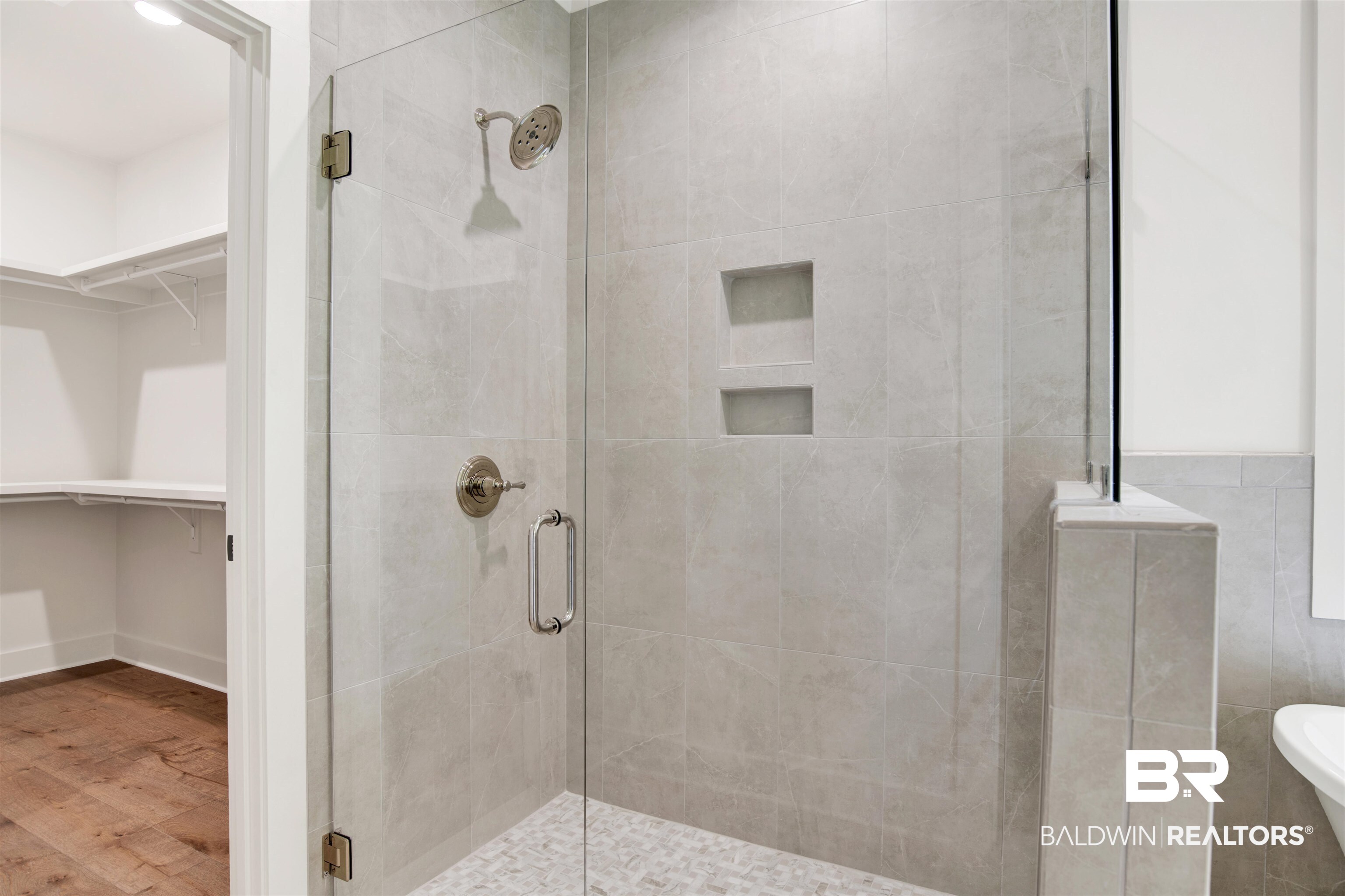 9275 Clarke Ridge Road Foley, AL 36535 - Photo 26 of 43 Full bath featuring a shower stall, a spacious closet, and wood finished floors